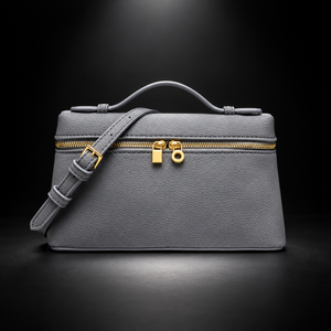Gray handbag on a black spotlight background